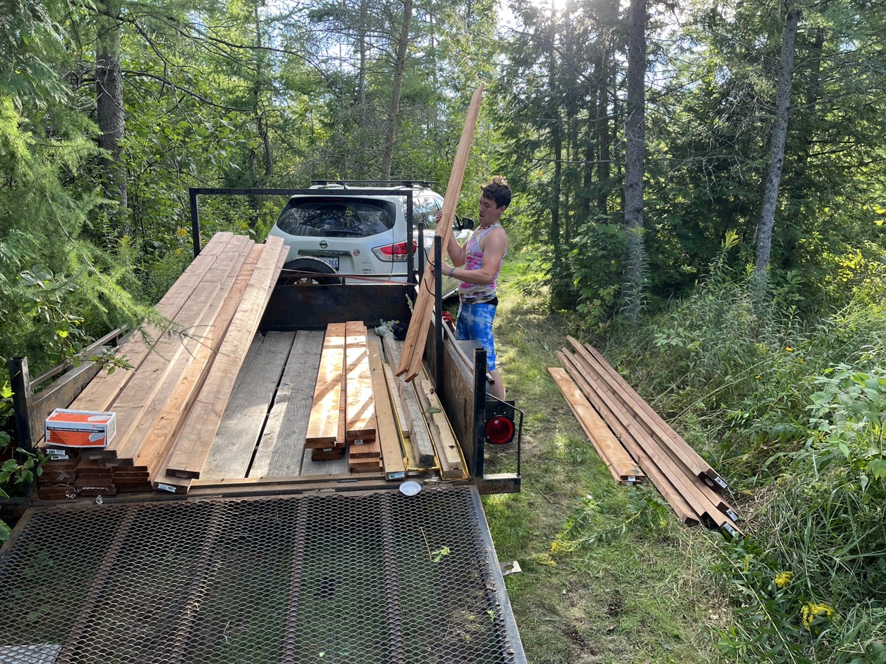 Loading lumber for building projects in the forest